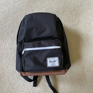 Herschel Pop Quiz backpack. Black & brown with red striped interior.